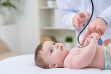 pediatrician-examining-infant